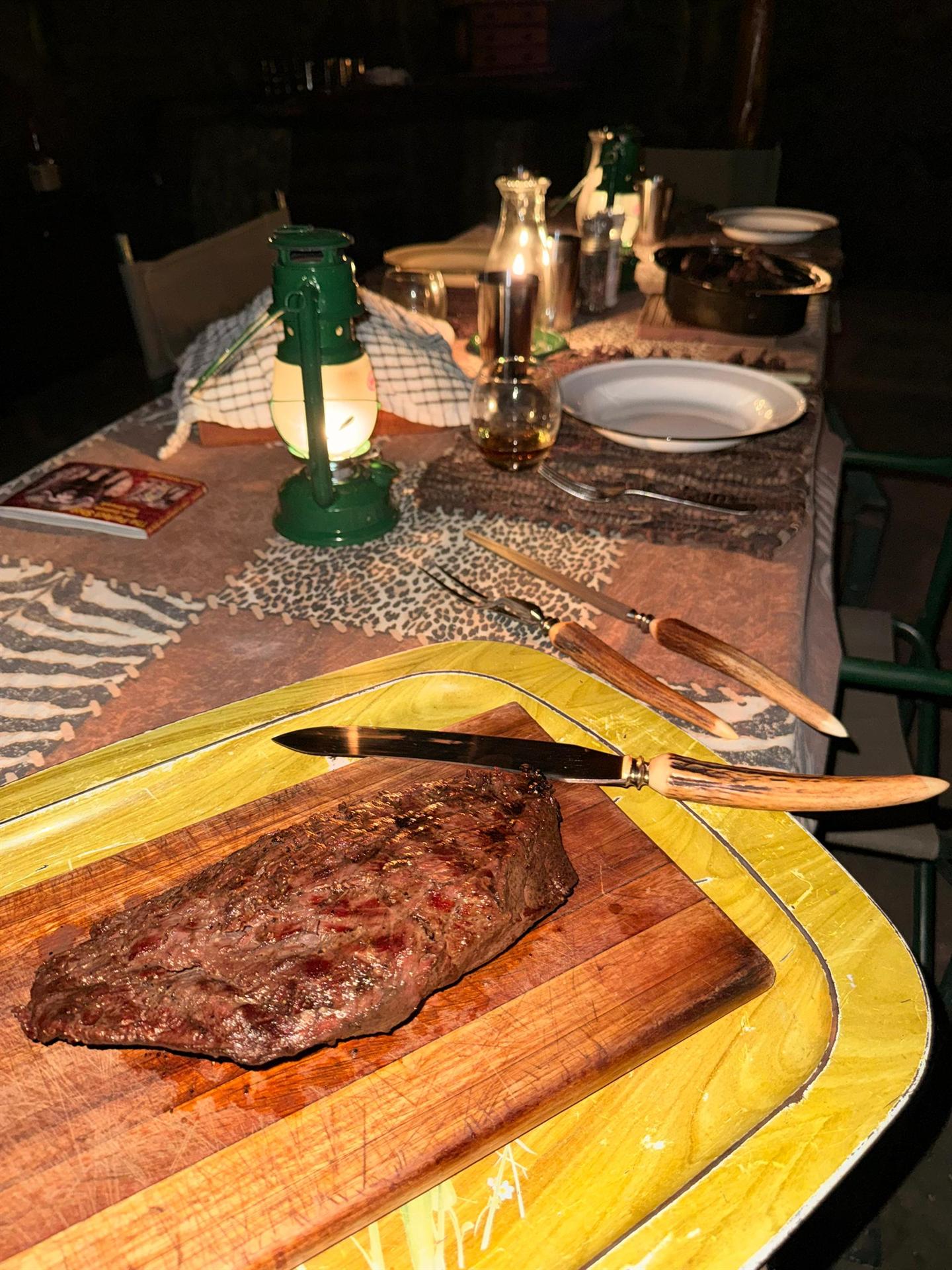 Game steak by lantern light